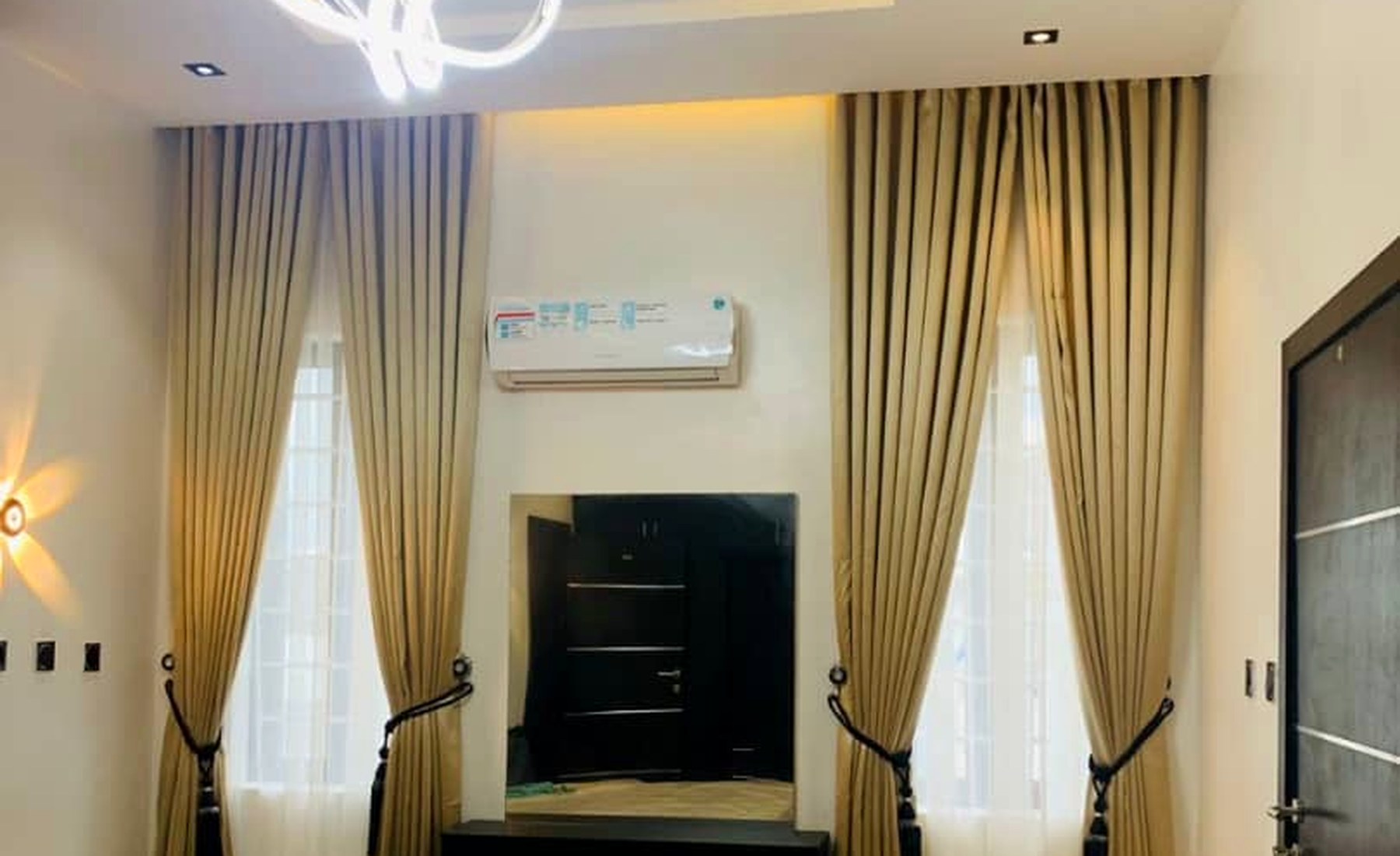 Champagne layered curtains in a contemporary living room
